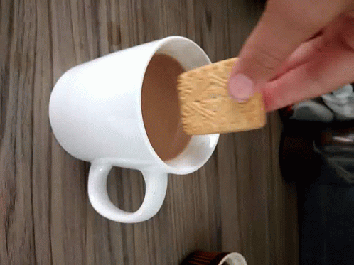 someone using a hand held item to get on a cup