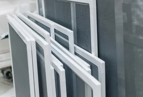 a window that has a metal rod and glass windows on the outside of it