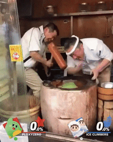 two men are pouring water into a bucket