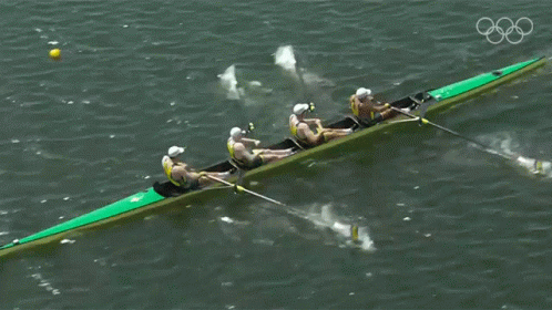 the men's eight rowing team is competing in the water