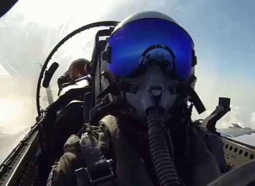 the view of the cockpit of a fighter jet from below