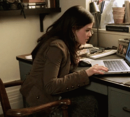 a person working on a laptop at a desk