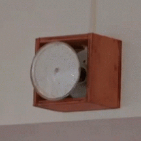 a ceiling fan that is mounted in a wall