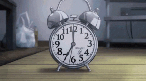 an animated clock sitting on top of a wooden floor
