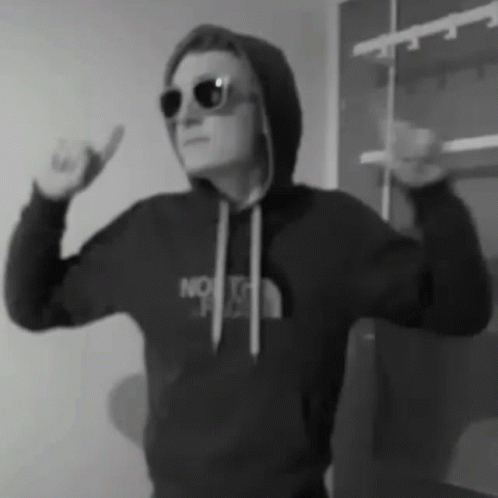 black and white image of man in a hoodie