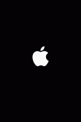an apple logo is seen in the dark