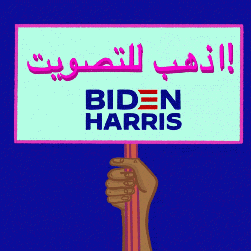 a person holding up a sign that reads bidn harris