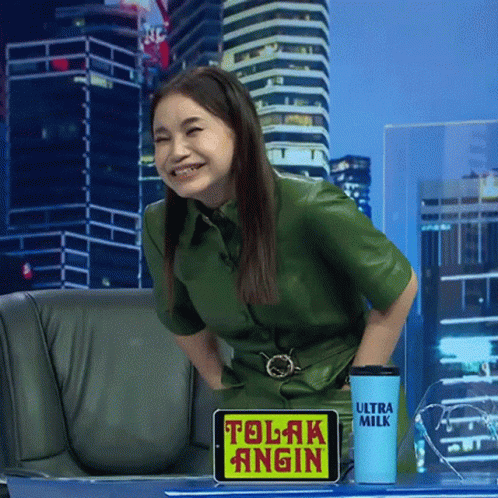 a news anchor smiles as she talks