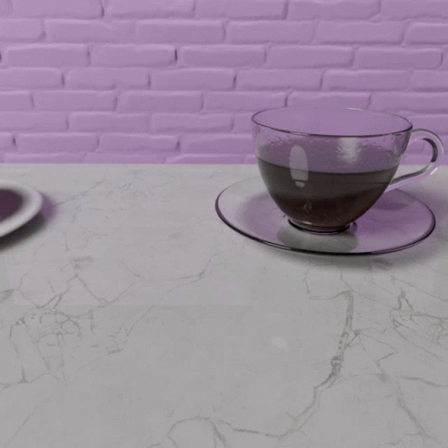a cup sitting on a table in front of a plate