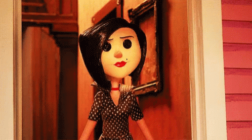 a doll is holding a broken tooth standing in a doorway