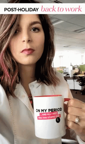 a woman with a coffee mug that says on my period