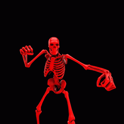 a fake skeleton has the arms open and one hand out