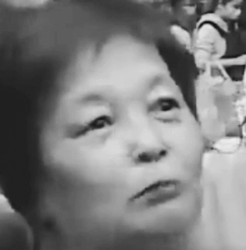 a black and white po of a woman looking up