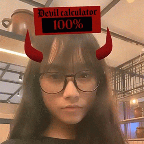 a young person with a devil horns on top of her head