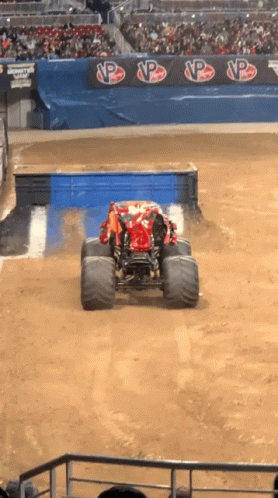 a monster truck is going down an obstacle course
