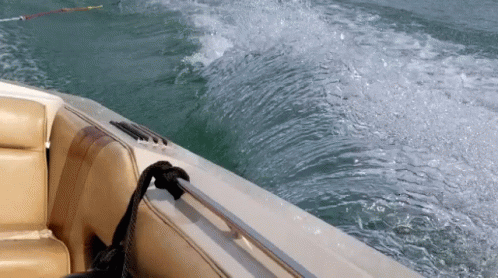 the wake of a wave is shown from a boat