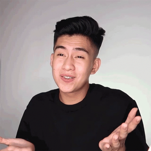 an asian man is making a funny gesture