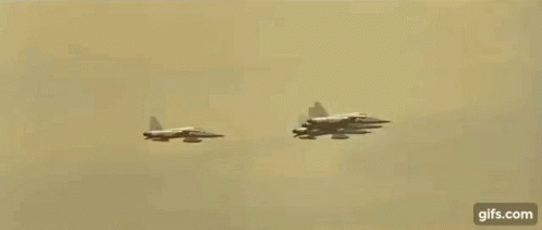 two air planes flying in formation next to each other