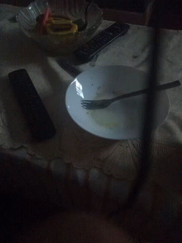 a plate, fork and knife sitting on the floor