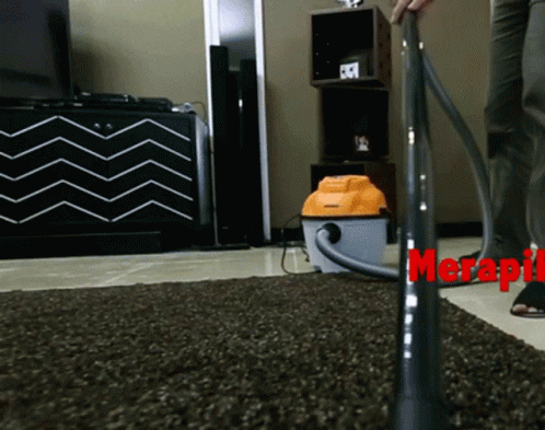 a vacuum is being used to clean a large carpet