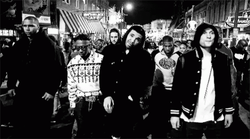 a black and white po of some people on a street