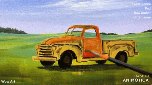 a blue truck in a green field with an orange sky