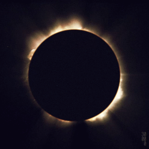 a dark blue colored object with an eclipse in the middle