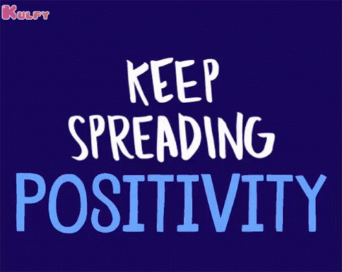 a red poster with words that say keep spreading positivity
