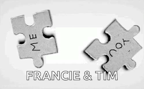 two metal pieces with the words france & tim in grey