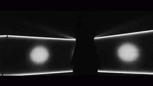 three lights are shown in the dark room
