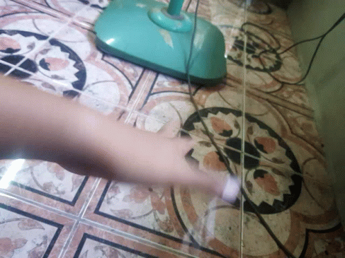 a floor polisher with a yellow base next to a blue and white floor