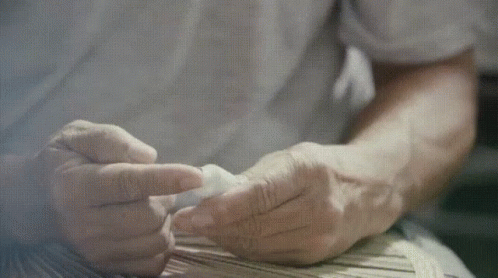 the hand of someone who is preparing soing