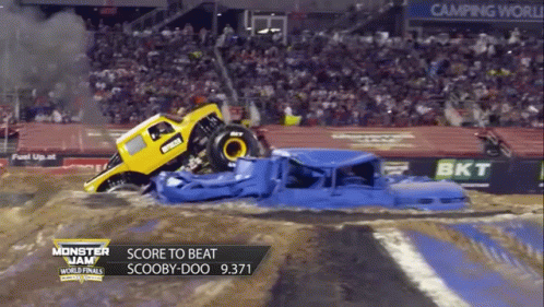 the monster truck ran into a huge car in an extreme race