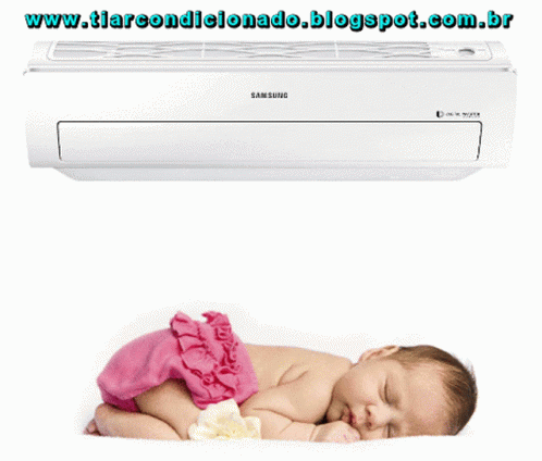 baby wrapped in a diaper laying underneath the air conditioner