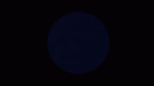 a dark colored circle in the middle of the sky