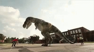 a man is trying to capture a giant dinosaur