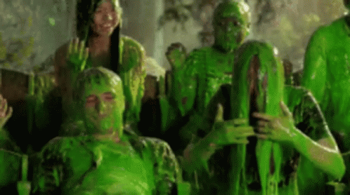 people that have green painted on their faces and hands