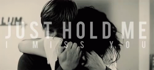 a man hugging a woman who says just hold me miss you
