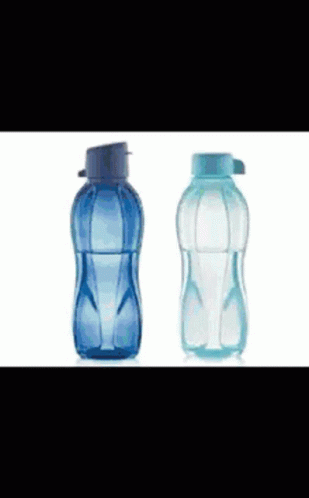 two empty bottles sitting side by side in a row