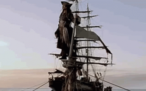 a black and white po of a man on the back of a pirate ship
