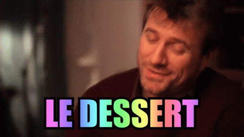a man laughing in the dark with text reading le dessert