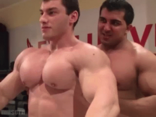 two men with muscle bodies and  posing for the camera