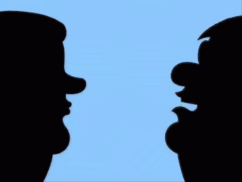 silhouettes of two men side by side with their hands together