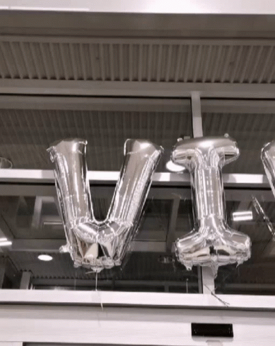a large balloon sign that is in the air