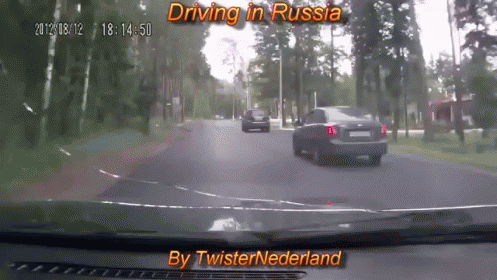 a very blurry po of some cars driving in russian