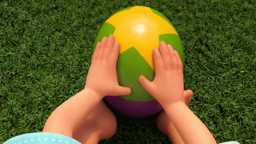 a person's feet propped against an inflatable ball