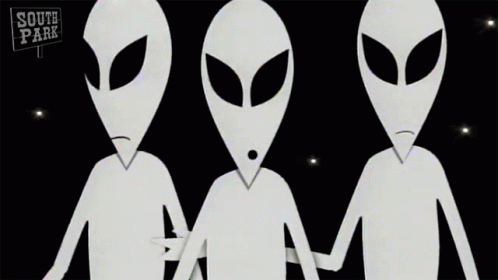 two alien puppets are standing against a black background