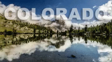 the logo for colorado is reflected in the lake