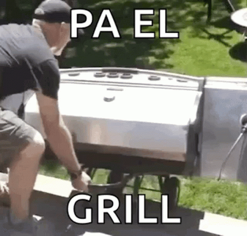a man is grilling on the back end of a cooler