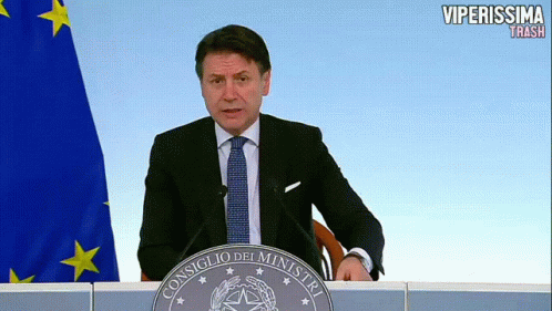 a man is giving a speech at a podium